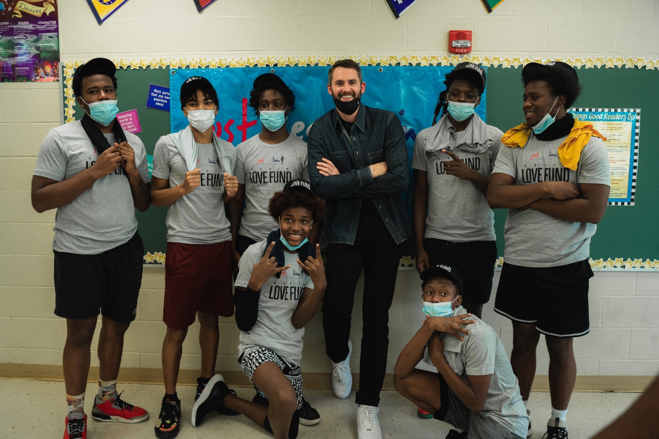 Kevin Love with students in classroom, Kevin Love Fund